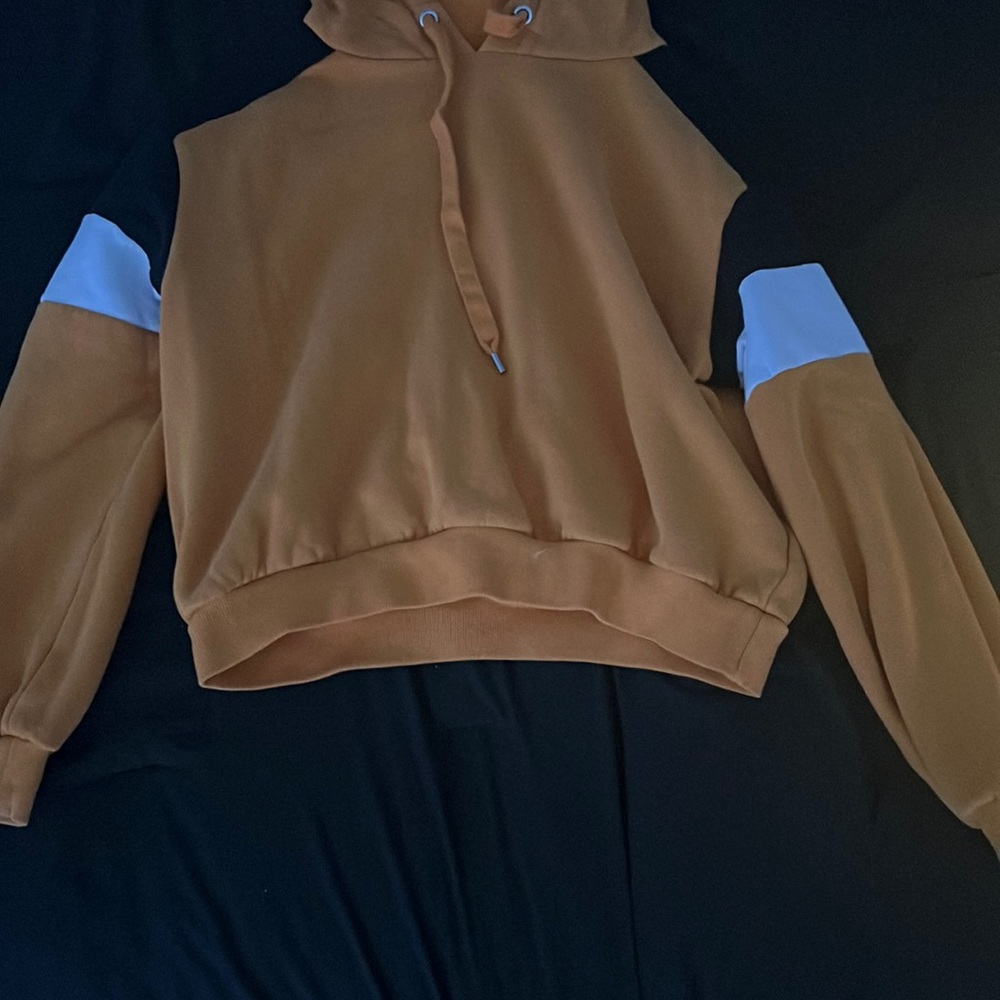 women sized Medium yellow hoodie with a yellow and white strip on each sleeve